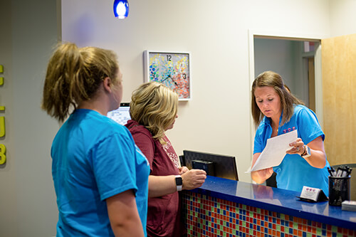 Ashley helping patients - Pediatric Dentist and orthodontist in Terre Haute, IN
